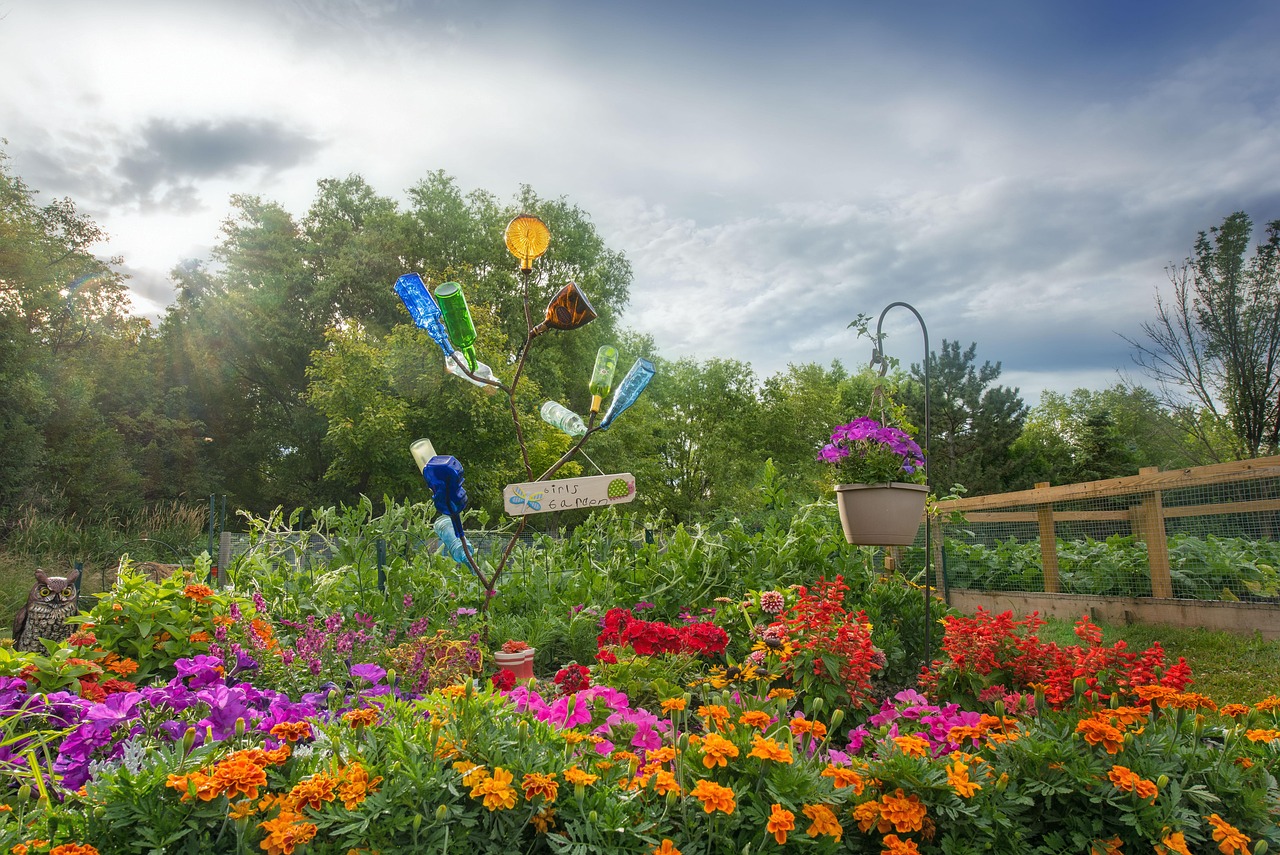 flowers in a garden bed planted by green and groom